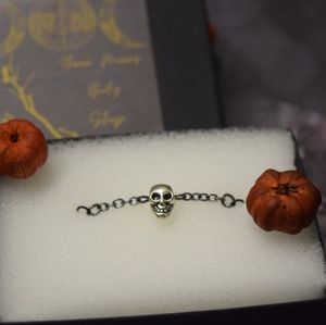 Skull centered nose chain